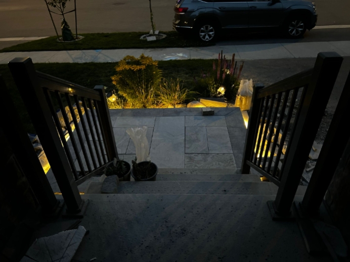 Custom outdoor patio with interlocking stonework and seating area